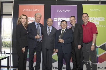 Photo of a group of people including Percy Vaz, CEO of AMCAL