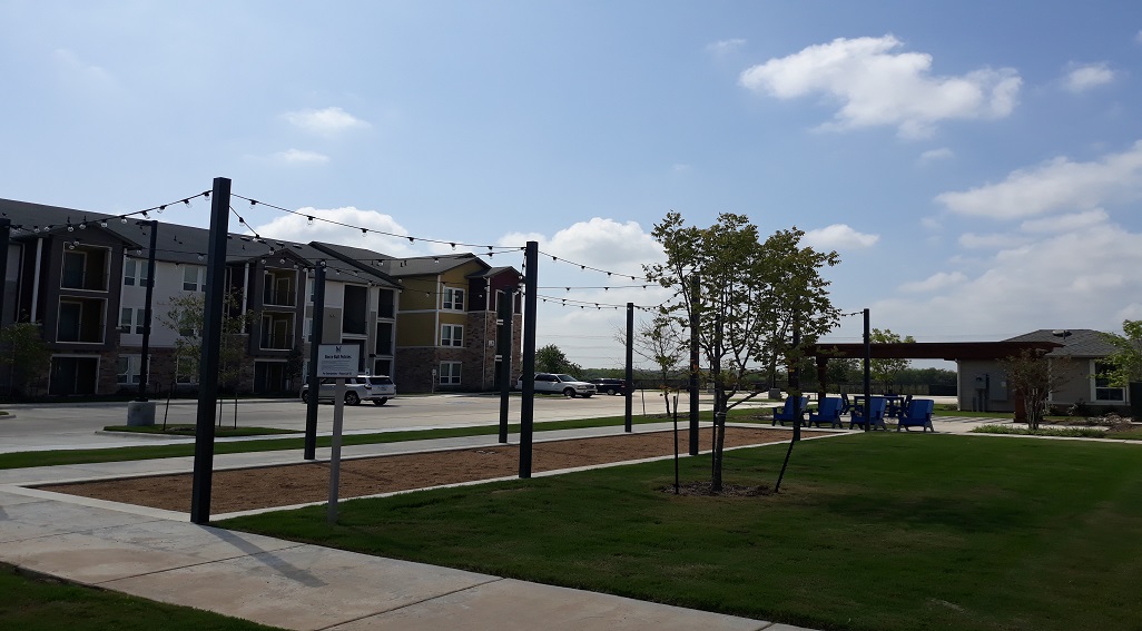 McKinney Apartments with grass area